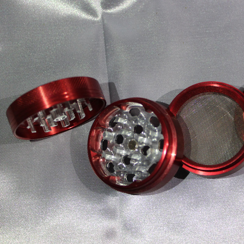 immagine di un grinder colore rosso in metallo 3 parti